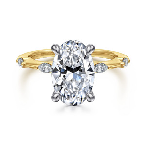Gabriel & Co. ER16432O12M43JJ 14 karat white and yellow gold Starlight engagement ring, front view of an oval center in teardrop prongs with elongated stones spaced along the shoulders
