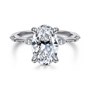 Gabriel & Co. ER16432O12W43JJ 14 karat white gold Starlight engagement ring, front view of an oval center with elongated stones spaced on the band to each side
