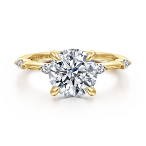 Gabriel & Co. ER16432R10Y43JJ 14 karat yellow gold Starlight engagement ring, front view of a round center on teardrop tipped prongs with an elongated stone on each side