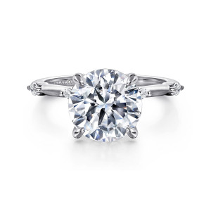 Gabriel & Co. ER16432R12W43JJ 14 karat white gold Starlight engagement ring, front view of a large round center with a small elongated diamond at each shoulder