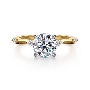 Gabriel & Co. ER16432R6M43JJ 14 karat white and yellow gold Starlight engagement ring, front view of a round center in four claws with elongated diamonds beside the head