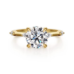 Gabriel & Co. ER16432R8Y43JJ 14 karat yellow gold Starlight engagement ring, front view of a round center held by four claws with an elongated diamond on each side