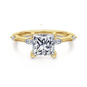 Gabriel & Co. ER16432S6Y43JJ 14 karat yellow gold Starlight engagement ring, front view of a princess cut center between elongated diamonds on a slim spaced band