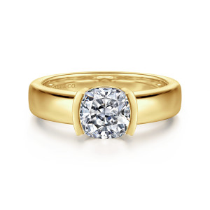 Gabriel & Co. ER16433C6Y4JJJ 14 karat yellow gold Contemporary engagement ring, front view of a cushion cut center gripped by two curved side bars on a wide polished band