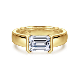Gabriel & Co. ER16433E6Y4JJJ 14 karat yellow gold Contemporary engagement ring, front view of an emerald cut center held between two upright bars on a wide smooth band