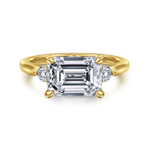 Gabriel & Co. ER16435E12Y44JJ 14 karat yellow gold Lotus engagement ring, front view of a crosswise emerald cut center with pointed prongs and a round stone at each side