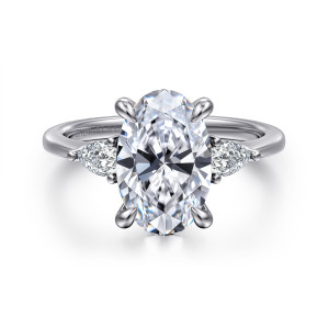 Gabriel & Co. ER16437O12W44JJ 14 karat white gold Classic engagement ring, front view of an oval center flanked by two pear shaped side diamonds pointing outward