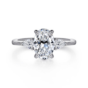 Gabriel & Co. ER16437O6W44JJ 14 karat white gold Classic engagement ring, front view of the oval center with pear shaped side stones pointing outward along the shoulders
