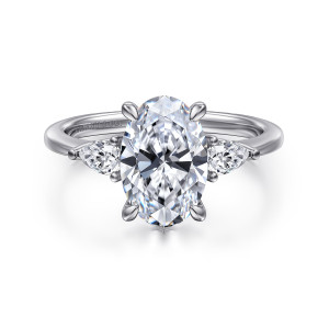 Gabriel & Co. ER16437O8PT4JJ platinum Classic engagement ring, front view of the large oval center with a tapered side stone pointing outward on each side