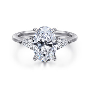 Gabriel & Co. ER16437O8W44JJ 14 karat white gold Classic engagement ring, front view of a broad oval center with tapering side stones and small beads at their outer points