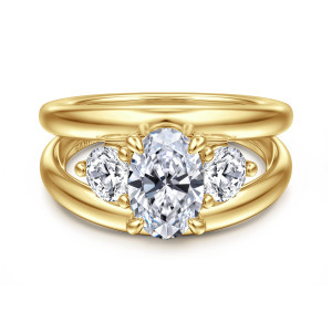 Gabriel & Co. ER16444O6Y44JJ 14 karat yellow gold Contemporary engagement ring, front view of an oval center flanked by rounded side stones, with the split arms parted behind