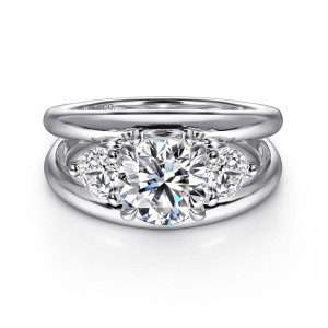 Gabriel & Co. ER16444R6W44JJ 14 karat white gold Contemporary engagement ring, front view of a round center flanked by side stones above the polished split band