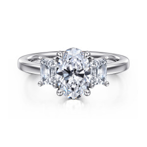 Gabriel & Co. ER16463O6W43JJ 14 karat white gold Classic engagement ring, front view of an oval center between two tapered step cut stones, all held by ball tipped prongs