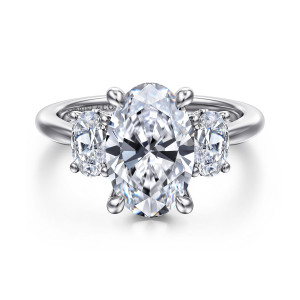 Gabriel & Co. ER16465O12W44JJ 14 karat white gold Classic engagement ring, front view of an oval center between two smaller oval side stones on a plain band