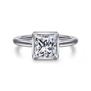 Gabriel & Co. ER16470S6W44JJ 14 karat white gold Contemporary engagement ring, front view of a princess cut center gripped by blocky corner posts on a plain square collar