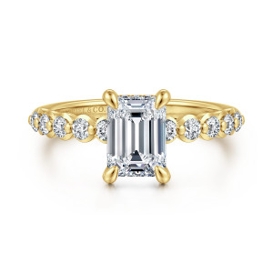 Gabriel & Co. ER16472E6Y44JJ 14 karat yellow gold Contemporary engagement ring, front view of an emerald cut center on teardrop prongs with round stones along the band