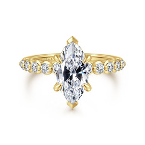 Gabriel & Co. ER16472M6Y44JJ 14 karat yellow gold Contemporary engagement ring, front view of a marquise center gripped by pointed end tips with round diamonds along the shoulders