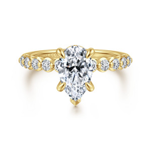Gabriel & Co. ER16472P6Y44JJ 14 karat yellow gold Contemporary engagement ring, front view of a pear shaped center with a pointed tip prong above round stones and beads