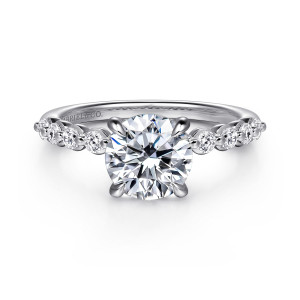 Gabriel & Co. ER16472R6W44JJ 14 karat white gold Contemporary engagement ring, front view of a round center flanked by round diamonds spaced with tiny beads along the shoulders