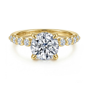 Gabriel & Co. ER16472R8Y44JJ 14 karat yellow gold Contemporary engagement ring, front view of a round center flanked by round diamonds in rounded cups on each shoulder