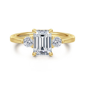 Gabriel & Co. ER16475E6Y44JJ 14 karat yellow gold Classic engagement ring, front view of an emerald cut center between round side stones with ball tipped prongs