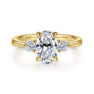 Gabriel & Co. ER16475O6Y44JJ 14 karat yellow gold Classic engagement ring, front view of an oval center with curved rounded prongs between two round side stones