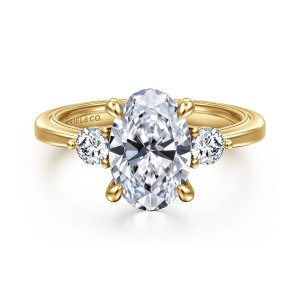 Gabriel & Co. ER16475O8Y44JJ 14 karat yellow gold Classic engagement ring, front view of an oval center on four claw prongs beside round side stones