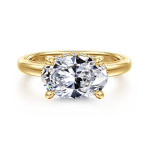 Gabriel & Co. ER16476O12Y44JJ 14 karat yellow gold Classic engagement ring, front view of an oval center set sideways in four claw prongs above a beaded band edge