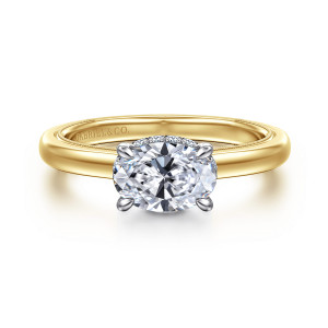 Gabriel & Co. ER16476O4M44JJ 14 karat white and yellow gold Classic engagement ring, front view of an oval center lying sideways in slim prongs on a smooth, domed band