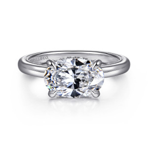 Gabriel & Co. ER16476O8W44JJ 14 karat white gold Classic engagement ring, front view of an oval center lying sideways in four slim prongs on a polished band