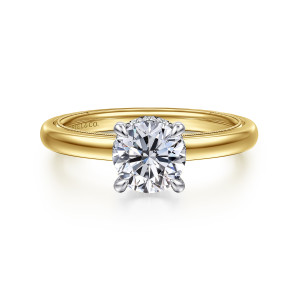 Gabriel & Co. ER16476R4M44JJ 14 karat white and yellow gold Classic engagement ring, front view of a round center in cooler tone prongs against a smooth, warmer band