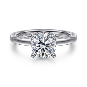 Gabriel & Co. ER16476R6W44JJ 14 karat white gold Classic engagement ring, front view of a round center in four prongs with beaded edging visible inside the domed band