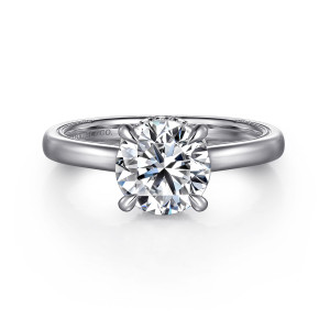 Gabriel & Co. ER16476R8PT4JJ platinum Classic engagement ring, front view of a round center in four prongs on a smooth broad band without stones