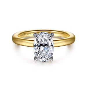 Gabriel & Co. ER16479O6M4JJJ 14 karat white and yellow gold Bujukan engagement ring, front view of an oval center in four slender prongs on a smooth plain band