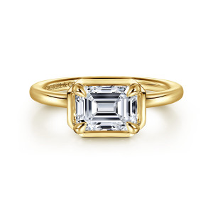 Gabriel & Co. ER16483E6Y4JJJ 14 karat yellow gold Contemporary engagement ring, front view of a sideways emerald cut center in a clipped corner frame with rounded claws