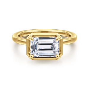 Gabriel & Co. ER16483E8Y4JJJ 14 karat yellow gold Contemporary engagement ring, front view of an emerald cut center lying sideways in a flat frame with clipped corners