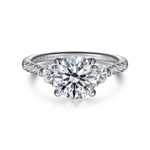 Gabriel & Co. ER16487R6W44JJ 14 karat white gold Lotus engagement ring, front view of a round center flanked by larger round diamonds with small stones on the band