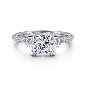 Gabriel & Co. ER16487S6W44JJ 14 karat white gold Lotus engagement ring, front view of a princess cut center between round side stones with small stones on the shoulders
