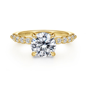 Gabriel & Co. ER16493R6Y44JJ 14 karat yellow gold Contemporary engagement ring, front view of a round center on rounded prongs with bezel set diamonds on both shoulders