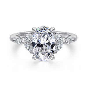 Gabriel & Co. ER16495O8W43JJ 14 karat white gold Floral Nouveau engagement ring, front view of an oval center with leaf shaped clusters of elongated stones beside the pointed prongs