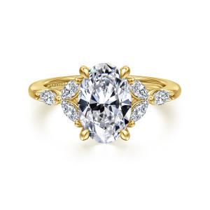 Gabriel & Co. ER16495O8Y43JJ 14 karat yellow gold Floral Nouveau engagement ring, front view of an oval center flanked by leaf like clusters of elongated stones and teardrop tipped prongs