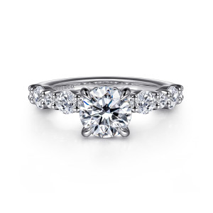 Gabriel & Co. ER16496R4W44JJ 14 karat white gold Contemporary engagement ring, front view of a round center held by four prongs with alternating stones on both shoulders