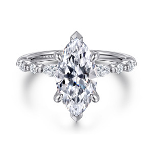 Gabriel & Co. ER16497M8W44JJ 14 karat white gold Contemporary engagement ring, front view of a marquise center with pointed end prongs and alternating stones on the shoulders