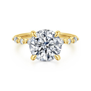 Gabriel & Co. ER16497R12Y44JJ 14 karat yellow gold Contemporary engagement ring, front view of a round center with teardrop tipped prongs and beaded shoulders holding small round diamonds