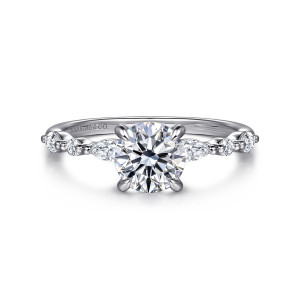 Gabriel & Co. ER16497R4W44JJ 14 karat white gold Contemporary engagement ring, front view of a round center with beaded shoulders that alternate elongated and round small stones