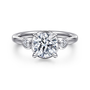 Gabriel & Co. ER16502R6W44JJ 14 karat white gold Contemporary engagement ring, front view of a round center held by four prongs between two small bezel set diamonds