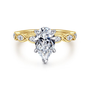 Gabriel & Co. ER16505P6M44JJ 14 karat white and yellow gold Contemporary engagement ring, front view of a pear shaped center with a pointed tip prong above looping, twisted shoulders