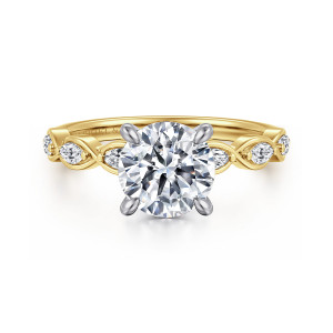 Gabriel & Co. ER16505R6M44JJ 14 karat white and yellow gold Contemporary engagement ring, front view of a round center in four claws with framed elongated stones along the shoulders