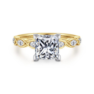 Gabriel & Co. ER16505S6M44JJ 14 karat white and yellow gold Contemporary engagement ring, front view of a princess cut center in corner prongs beside looped ribbons holding elongated diamonds