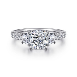 Gabriel & Co. ER16507C6W44JJ 14 karat white gold Lotus engagement ring, front view of a cushion cut center between half moon side stones and small round band diamonds